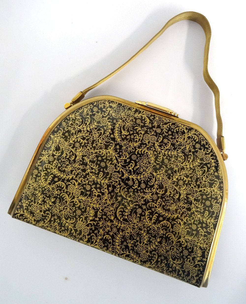 1950s HARD SHELL EVENING BAG BY STRATTON with floral gilt decoration on a black ground, opening to - Image 2 of 2