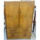 WALNUT DRESSING CHEST the raised back above a pair of cupboard doors with two drawers below,