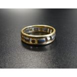 EIGHTEEN CARAT TWO TONE GOLD RING the band with pierced decoration, ring size Q and approximately