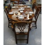 EDWARDIAN MAHOGANY OVAL TOP DINING TABLE with two extra leaves, raised on stout cabriole legs with