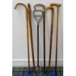 SELECTION OF WALKING STICKS including an African stick with a carved figural handle, a shooting