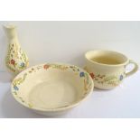 FRENCH POTTERY WASH BOWL and ewer with a cream ground and decorated with floral motifs, together