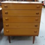 PAIR OF SCHREIBER TEAK CHESTS each with a moulded top above five drawers with circular shaped