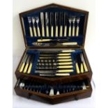 OAK CASED CANTEEN OF CUTLERY comprising six place settings of fish knives and forks, table knives