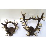 PAIR OF ANTLER CANDELABRA each of irregular form with multiple tea light holders around a central