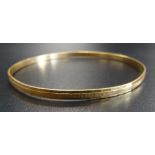 TWENTY-ONE CARAT GOLD BANGLE marked 875, approximately 9.7 grams