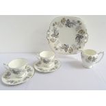 COALPORT 'CAMELOT' PATTERN TEA SET with floral decoration, comprising thirteen cups, fourteen