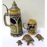 THREE GRADUATED WADE TORTOISES decorated in brown and blue, a musical stein with a pewter lid, the