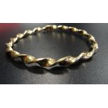 NINE CARAT GOLD TWIST DESIGN BANGLE approximately 5.4 grams