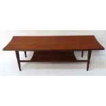 RETRO 1960's TEAK COFFEE TABLE with undertier and raised on tapering legs, 121cm long x 40.5cm wide