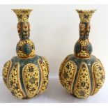 PAIR OF HIGHLY DECORATIVE ZSOLNAY PECS PIERCED POTTERY BOTTLE VASES the pierced flared rim on each