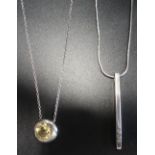 DIAMOND SET DROP PENDANT and a circular bezel set citrine pendant, both in silver and on silver