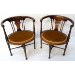 PAIR OF EDWARDIAN MAHOGANY PARLOUR CHAIRS with hoop backs above a shaped splat with stuffover