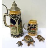 THREE GRADUATED WADE TORTOISES decorated in brown and blue, a musical stein with a pewter lid, the