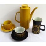 TWO RETRO POTTERY PART COFFEE SERVICES one a Meakin Maidstone pattern example of burnt yellow ground