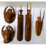 SELECTION OF CARVED AFRICAN HARDWOOD ANIMAL MASKS including a pair of Impalas, 33cm high, single