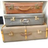 LEATHER SUITCASE with reinforced corners and carry handle, 61.5cm wide, a faux leather suitcase with