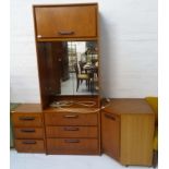 SAKOL TEAK DRESSING CUPBOARD with a moulded square top above a lift up cupboard door, with a pair of