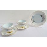 GLADSTONE TEA SERVICE the white and blue ground with floral decoration, comprising eleven cups and