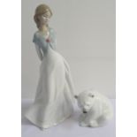 LLADRO POLAR BEAR sat on its haunches, 8.5cm high, together with a Nao figurine of a young girl,