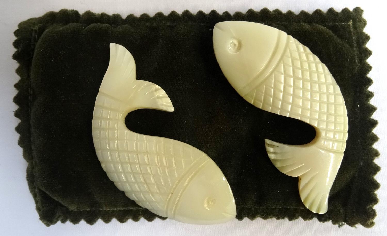 PAIR OF MOTHER OF PEARL in the form of fish with scale detail, each approximately 7cm long