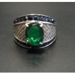 UNUSUAL DIAMOND, SAPPHIRE AND GREEN STONE SET DRESS RING the central oval cut green stone flanked by