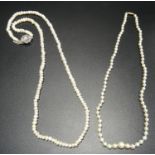 TWO PEARL NECKLACES one a graduated example with gold clasp, 42cm long; and the other with pearl set
