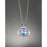 ENAMEL DECORATED SILVER PENDANT of pierced quatrefoil design, on silver chain