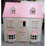 CHILD'S DOLLS HOUSE of wooden and plastic construction with an opening double front revealing two
