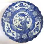 JAPANESE PORCELAIN WALL CHARGER early 20th century, with ribbed body and frilly border, the