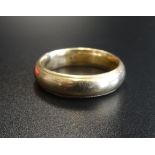 FOURTEEN CARAT GOLD WEDDING BAND ring size V and approximately 9.1 grams