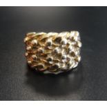 HEAVY NINE CARAT GOLD DRESS RING with textured decoration, ring size Y and approximately 17.1 grams