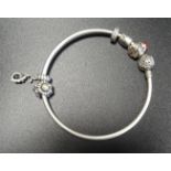 PANDORA MOMENTS SILVER CHARM BANGLE the clasp with entwined decoration, with five Pandora charms