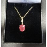 RUBY AND DIAMOND PENDANT the oval cut ruby approximately 3cts below a round brilliant cut diamond of