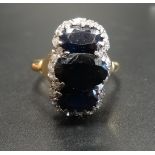 SAPPHIRE AND DIAMOND CLUSTER DRESS RING the central three oval cut sapphires in unusual vertical