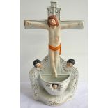 19th CENTURY STAFFORDSHIRE HOLY WATER FONT modelled as Christ on the Cross, above an Angel Font base