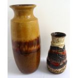 TWO WEST GERMAN VASES comprising a brown slip ware vase with a flared rim, the base impressed '239-