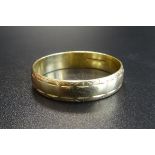 EIGHTEEN CARAT GOLD WEDDING BAND ring size W and approximately 3.6 grams
