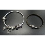 SELECTION OF PANDORA JEWELLERY comprising a Moments silver bangle with five charms; together with