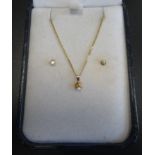 DIAMOND SET PENDANT AND PAIR OF EARRINGS all in fourteen carat gold, the pendant on fourteen carat