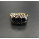 SAPPHIRE AND DIAMOND CLUSTER DRESS RING the three central sapphires in multi diamond surround, on