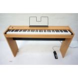 ROLAND F-90 DIGITAL PIANO in a maple style case with an eight eight note digital piano hammer action