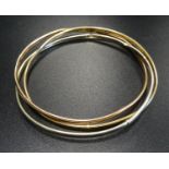 NINE CARAT GOLD RUSSIAN WEDDING RING STYLE TRIPLE BANGLE comprising white, yellow and rose gold