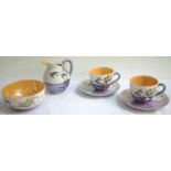 JAPANESE PORCELAIN TEA SERVICE decorated with floral and bird motifs comprising tea cups and