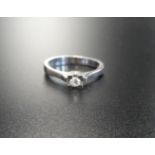 DIAMOND SOLITAIRE RING in fourteen carat gold, the diamond approximately 0.1cts, ring size N-O,