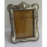 GEORGE V SILVER PHOTOGRAPH FRAME of shaped outline with easel support, Birmingham hallmarks for