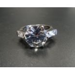 CUBIC ZIRCONIA COCKTAIL RING the central round cut stone approximately 4cts flanked by further CZ to