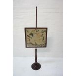 MAHOGANY POLE SCREEN with a square needlework panel depicting a deer, on a turned column and