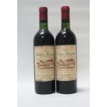 CHATEAU BOUSCAUT 1967 VINTAGE A pair of vintage bottles of Bordeaux. Chateau Bouscaut 1967