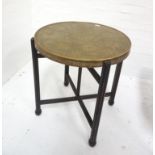 INDIAN BRASS OCCASIONAL TABLE with a circular top decorated with geometric, floral and hammered